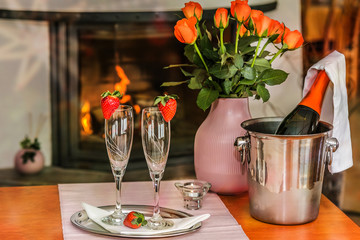 A glass with the champagne, decorated with a strawberry. Romantic composition with champagne and strawberry