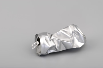 Crumpled empty blank soda or beer can garbage. Crushed junk can recycle