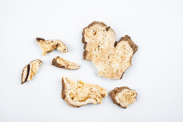 Chinese traditional medicinal herbs atractylodes tablets on white background