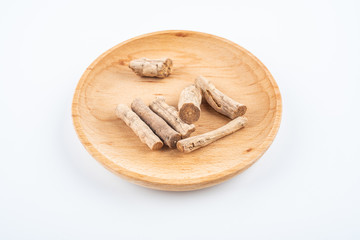 Fried Achyranthes bidentata with traditional chinese medicine on white background