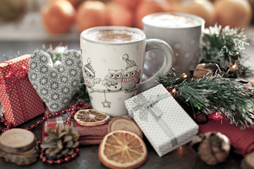 Obraz na płótnie Canvas People, Christmas, holidays concept. Christmas drink. Gray mug of hot tea, cocoa, coffee with marshmallows, oranges