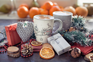 People, Christmas, holidays concept. Christmas drink. Gray mug of hot tea, cocoa, coffee with marshmallows, oranges