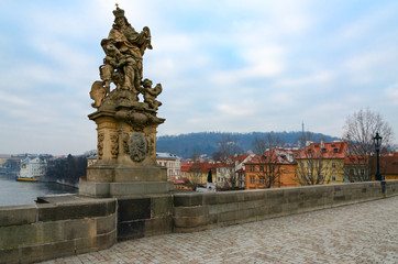 Fototapeta na wymiar Sculptural compositions of Charles Bridge, Prague, Czech Republic. Saint Ludmila, Czech princess, first martyr and first patroness of Czech Republic