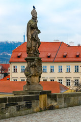 Fototapeta na wymiar Sculptural compositions of Charles Bridge, Prague, Czech Republic. St. Vojtech (Adalbert of Prague), second bishop of Prague