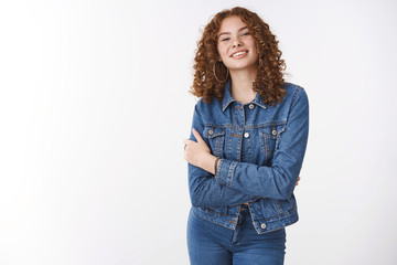 Confident feminine attractive sassy redhead woman with freckles pimples wearing denim jacket jeans...