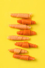 fruit rolls from orange, mango, banana on a yellow background. Sweet Sugar Free