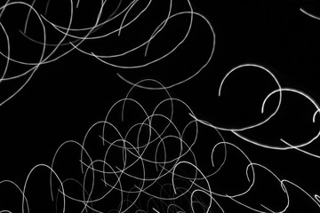 Abstract light trails background monochrome pattern.