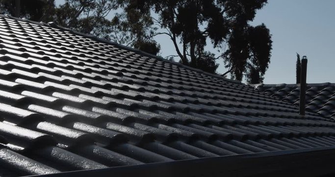 Sunlight reflecting off the freshly painted roof tiles