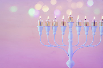 Religion image of jewish holiday Hanukkah background with menorah (traditional candelabra) and candles