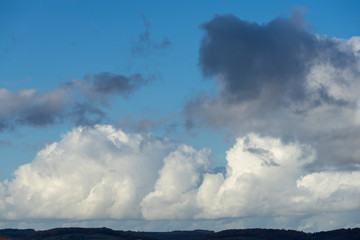 Fototapeta na wymiar white and grey clouds in a blue sky