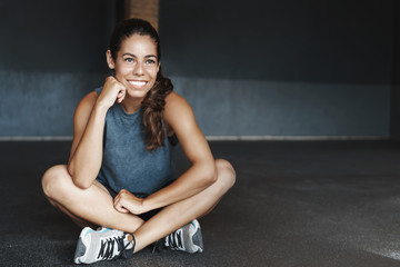 Endurance, women and fitness concept. Good-looking young healthy and sporty female athlete finish...