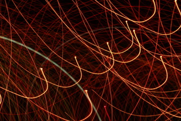 Dynamic lights in dark background. High speed in night time abstraction. Colorful LED light trails background. Motion blur effect.