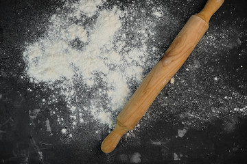 selective focus, scattered wheat flour on a dark background