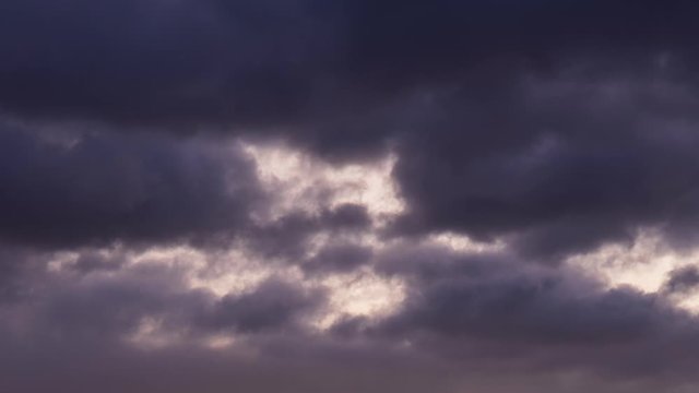 timelapse of a cloudy sky before sunrise