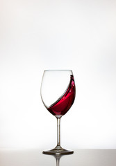 Glasses with moving red wine 