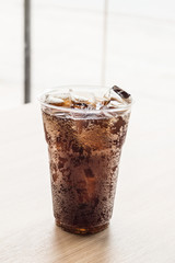 Glass of fresh cola with ice