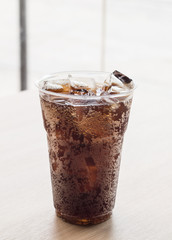Glass of fresh cola with ice