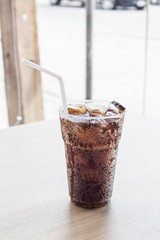 Glass of fresh cola with ice