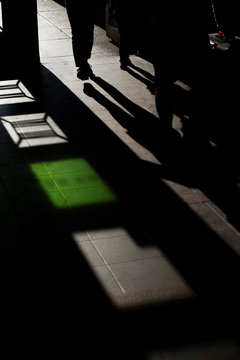 People Heading On An Adventure Among Harsh Light And Shadow