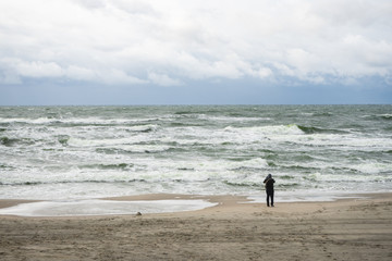 Fototapeta na wymiar selective focus, the Baltic sea and man