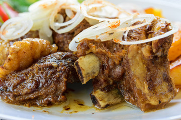 Lamb stew with vegetables. Baked Potato and fresh vegetables with lamb.
