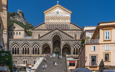 Positano, Italy - August 12, 2019: Tourists walk on the stairs of Amalfi Cathedral in summer time