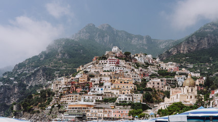 Fototapeta na wymiar Monte San Michele with morning fog and Positano Village in Amalfi Coast in Italy