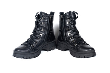 Black leather boots for the cold season on a white background, waterproof