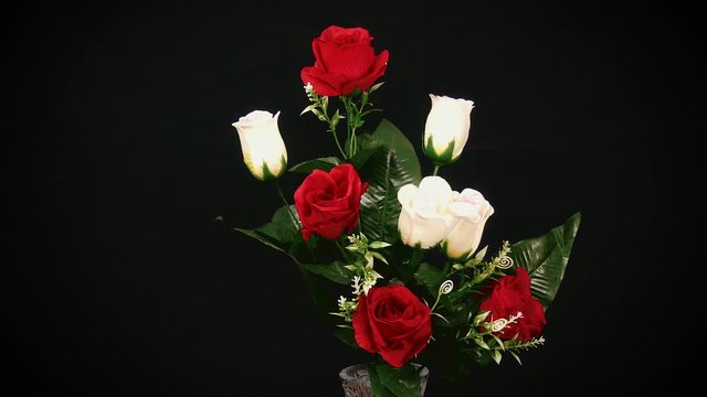 Flowrs In Vase Rotate Over Black Background
