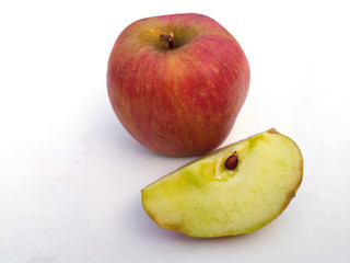 a fresh healthy red apple with a bite of apple isolated on white background