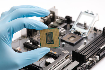 Hand hold cpu processor of pc, close-up.