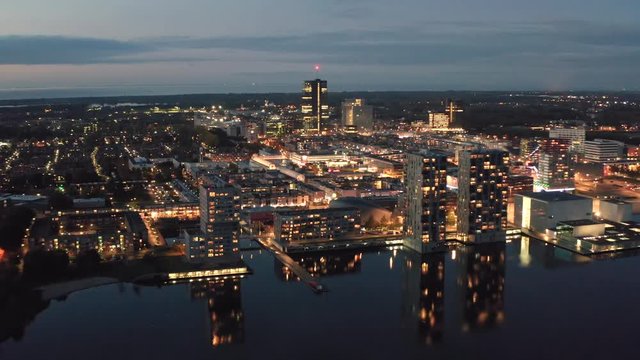 Aerial shot of Almere city center at dusk, a modern suburban town near Amsterdam, in province Flevoland