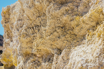 Yellow sulfur crystals in the Nisyros volcano crater.