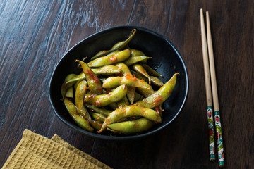 Spicy Sambal Edamame with Chopsticks / Spiced Style with Red Hot Chili Sauce.