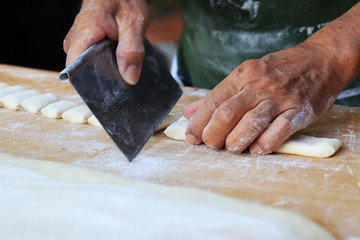 chef preparing dough in kitchen