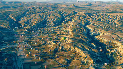 Aerial view of air balloon over fields, Cappadocia, Turkey. Aerial summer view from air balloon...