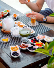 set with lots of sweets with black tea