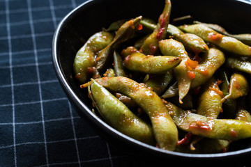 Spicy Sambal Edamame with Chopsticks / Spiced Style with Red Hot Chili Sauce.