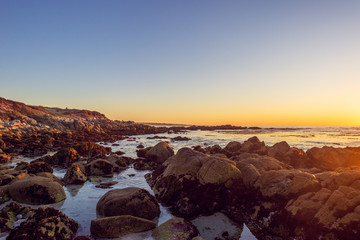 Obraz premium gorgeous sunset on a rocky rugged coast