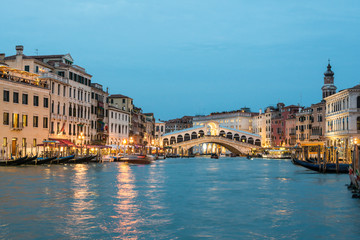 Fototapeta na wymiar Grand Canal and Rialto Bridge at the dusk time. Venice, Italy.