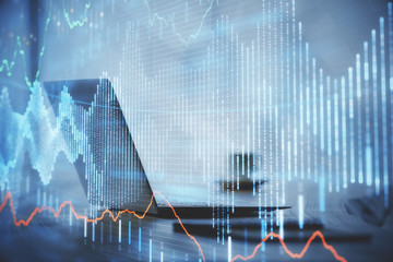 Double exposure of graph and financial info and work space with computer background. Concept of...