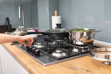 Close up on woman cooking healthy vegetables in bright kitchen