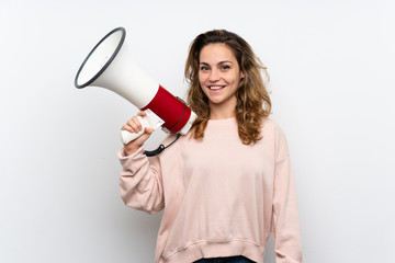 Young blonde woman holding a megaphone