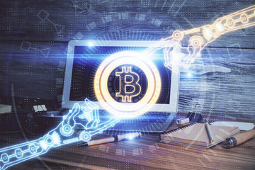 Multi exposure of blockchain theme hologram and table with computer background. Concept of bitcoin...
