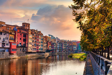 View of the Spanish city of Girona. Old Town, Sunset sky,.colorful houses and the Onyar river. - 306535229