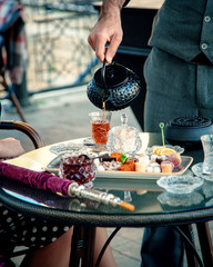 tea set with black tea and hookah