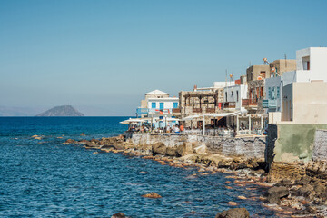 Fototapeta na wymiar Cafes and restaurants by the sea on the Nisyros island