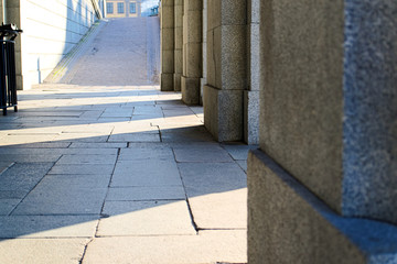 sunlight through the concrete columns of the Palace in Stockholm, copy space