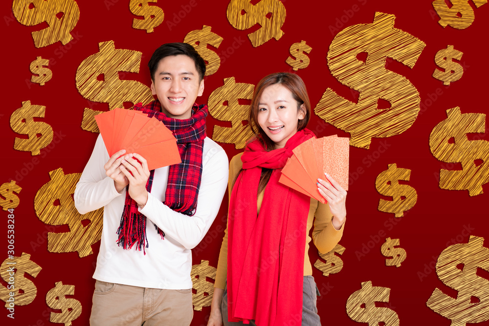 Wall mural happy asian young couple celebrating  chinese new year