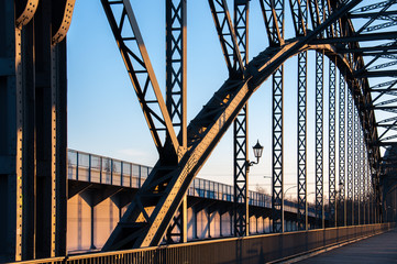 The old Harburger elbe bridge in a sunsetlight, a steel arch bridge connecting the Hamburg districts of Harburg and Wilhelmsburg via the southern Elbe.